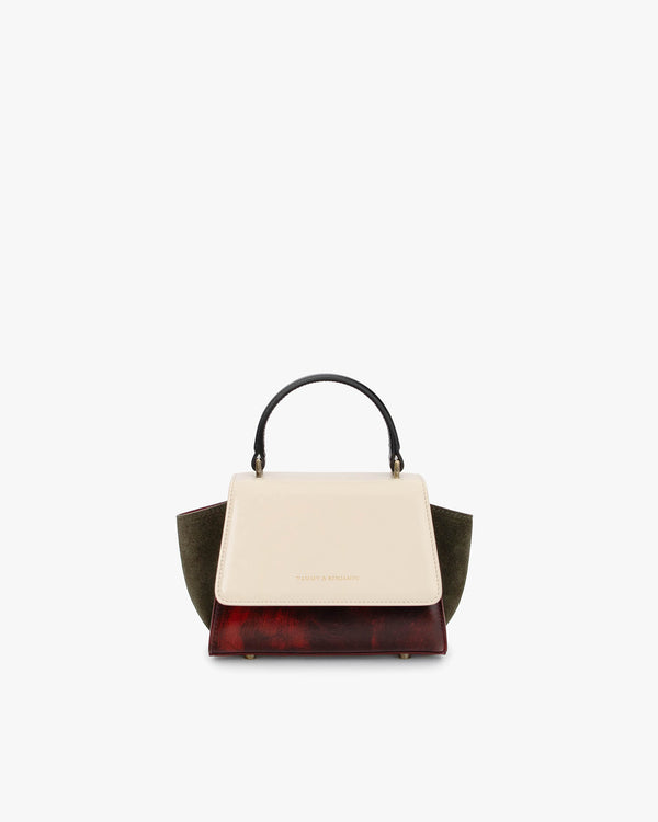 Sac ALEXIA NANO Colourblock art déco de face, poignée noire, rabat écru, ailes kaki, base bordeaux