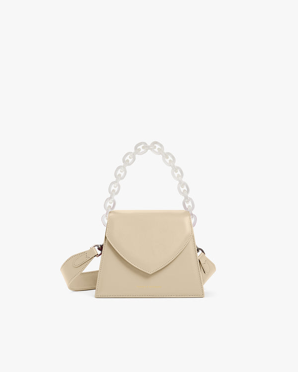 Sac GABRIELLE beige de face, anse chaîne translucide et bandoulière en cuir ajustable