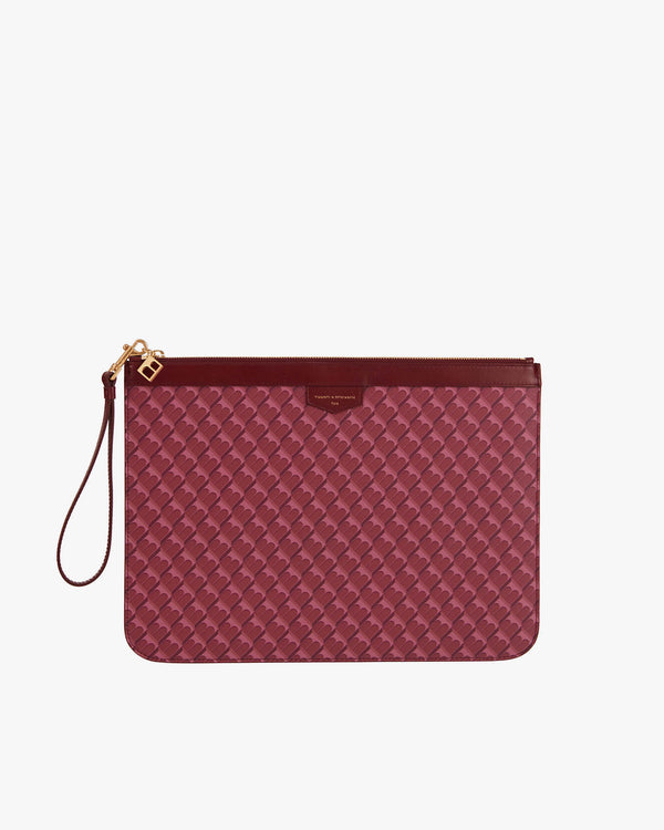 POCHETTE GM MONOGRAM Bordeaux, vue de face avec dragonne en cuir détachée, posée