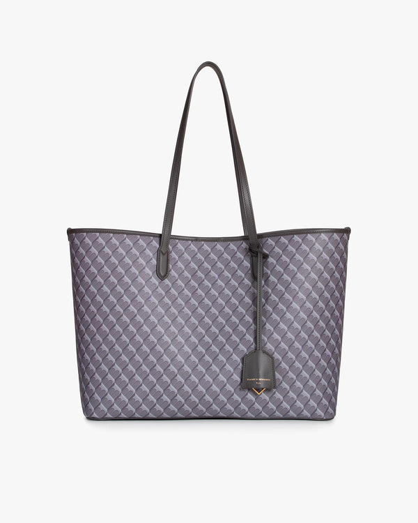 TOTE MONOGRAM gris, vue de face avec anses longues en cuir et pampille logo