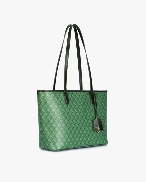 TOTE MONOGRAM PM vert, vue de trois quarts, anses hautes en cuir, posé sur fond blanc