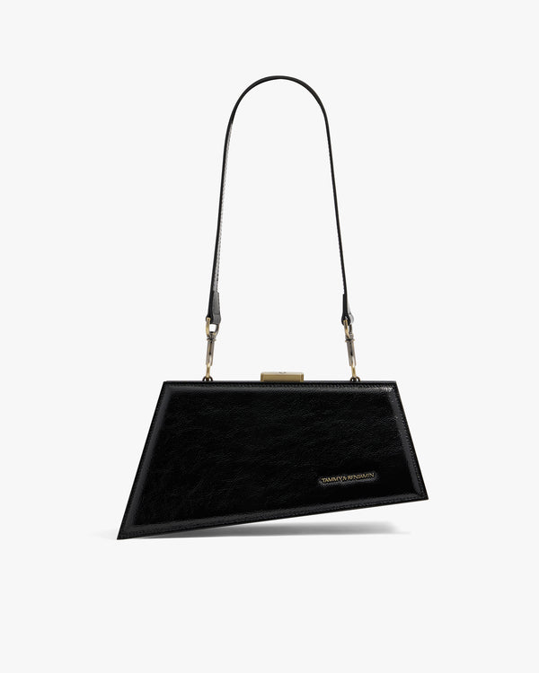 JAY bag in black naplak, front view with long strap and gold clasp