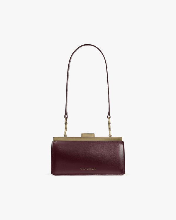 Sac JEANNE BAGUETTE Mahogany de face, anse longue portée, fermoir doré apparent