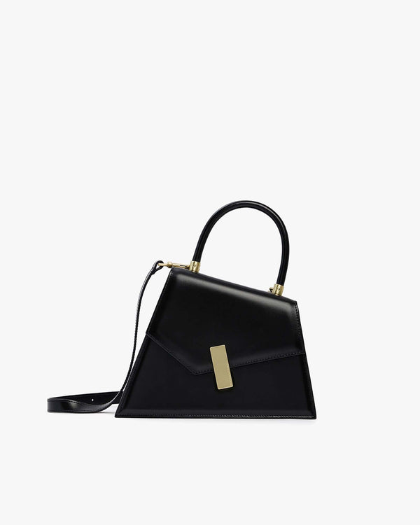 Sac CUBIST noir en cuir, vue de profil, poignée ronde relevée, fermoir doré et bandoulière fine