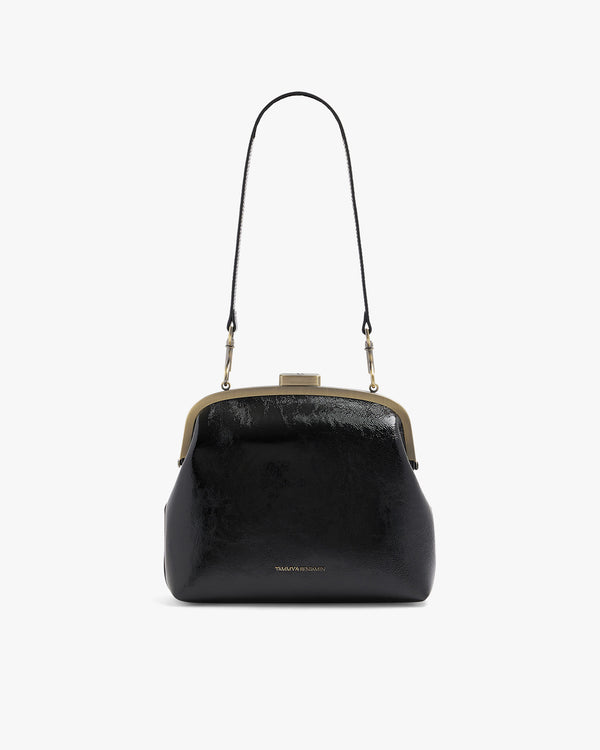 EMMA bag in black naplak, front view with long leather strap, clasp closed