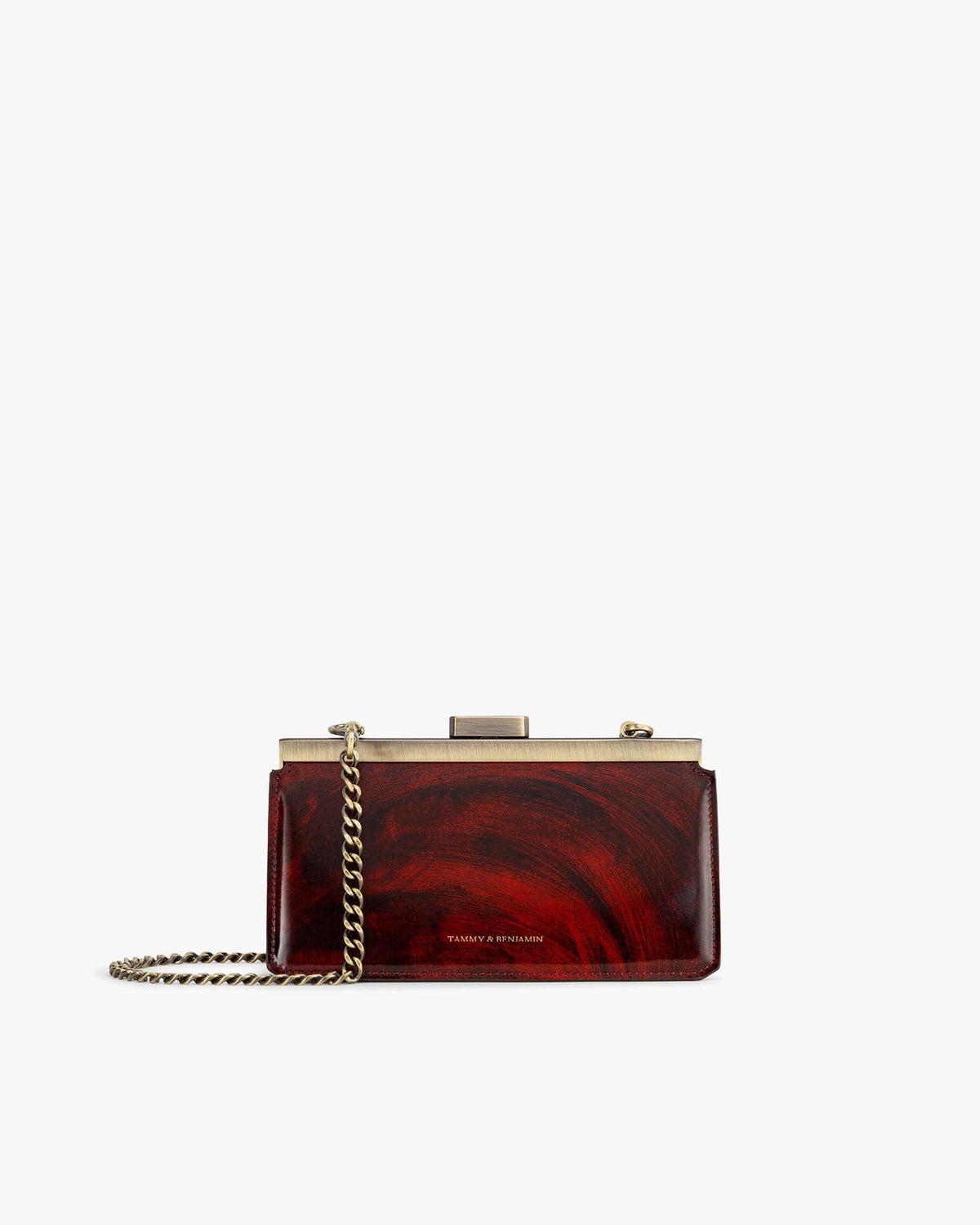 Sac JEANNE BAGUETTE en cuir marbré, vue de face avec fermoir rétro doré et chaîne bandoulière