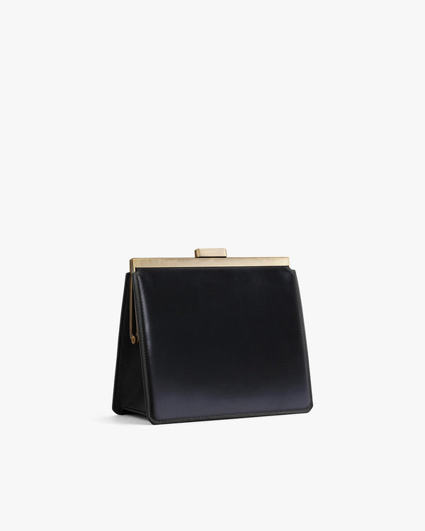 JEANNE bag in black, side view, gold metal clasp, shown without strap