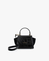 ALEXIA NANO bag in black naplak, front view with top handle and suede side wings