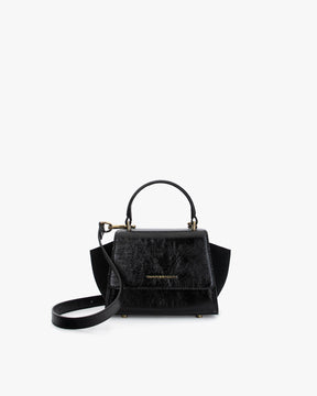 ALEXIA NANO bag in black naplak, front view with top handle and suede side wings