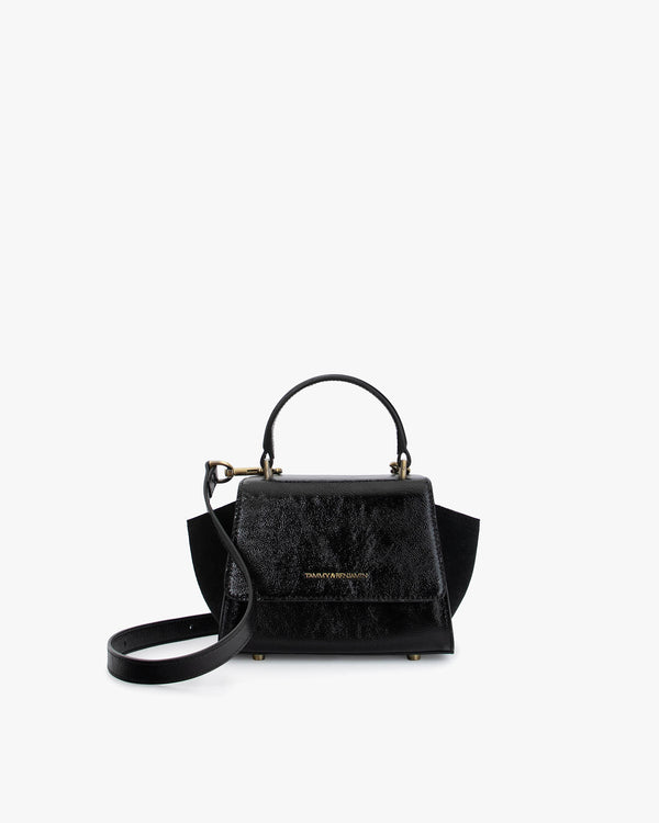 Sac ALEXIA NANO noir naplak de face, poignée courte et ailes latérales en daim visibles