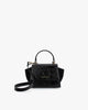 Sac ALEXIA NANO noir naplak de face, poignée courte et ailes latérales en daim visibles