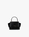 ALEXIA NANO bag in black naplak, front view, top handle, side wings and flap closure visible