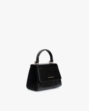 ALEXIA NANO bag in black naplak, three-quarter view, standing, top handle