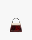 Sac ALEXIA NANO colourblock art déco, vue de face, rabat crème et corps bordeaux marbré, anse noire