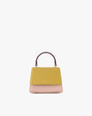 Sac ALEXIA NANO Colourblock Vesper de face, rabat jaune moutarde, corps rose, poignée bordeaux