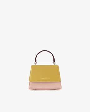 Sac ALEXIA NANO Colourblock Vesper de face, rabat jaune moutarde, corps rose, poignée bordeaux