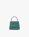 Sac ALEXIA NANO turquoise, vue de face, posé, anse courte relevée