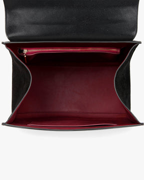 ALEXIA bag in black naplak, open interior view, flap lifted, zip pocket and burgundy lining