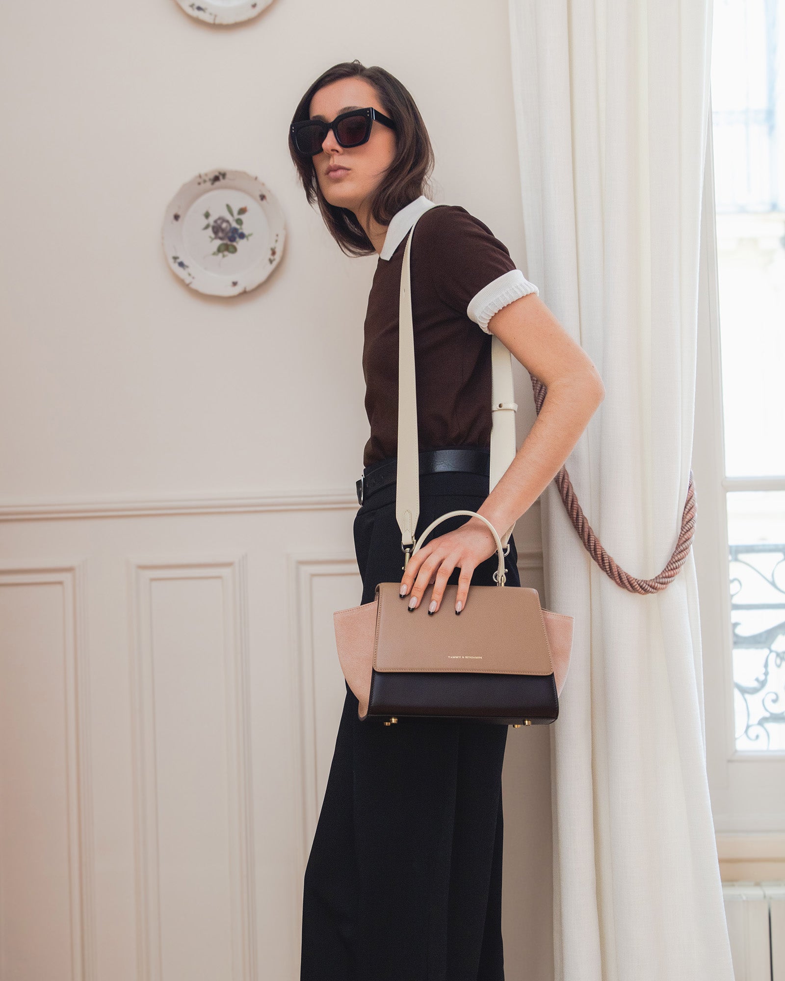 ALEXIA bag in Colourblock Marlowe, held by hand with cream crossbody strap worn across body