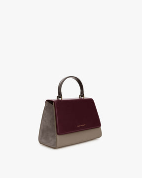 ALEXIA bag in Colourblock Stratum, three-quarter view, top handle, burgundy flap and grey side panels