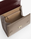 ALEXIA bag in Colourblock Stratum, open view showing beige interior with zip pocket and gold clasp