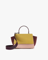 Sac ALEXIA Colourblock Vesper de face, poignée haute et bandoulière amovible posée au sol