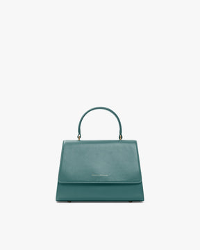 Sac ALEXIA turquoise, vue de face, posé, anse gainée relevée, fermé par son rabat
