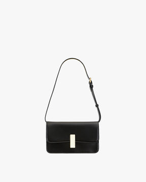 BLAKE bag in Black, front view, resting, with gold rectangular clasp and thin adjustable strap