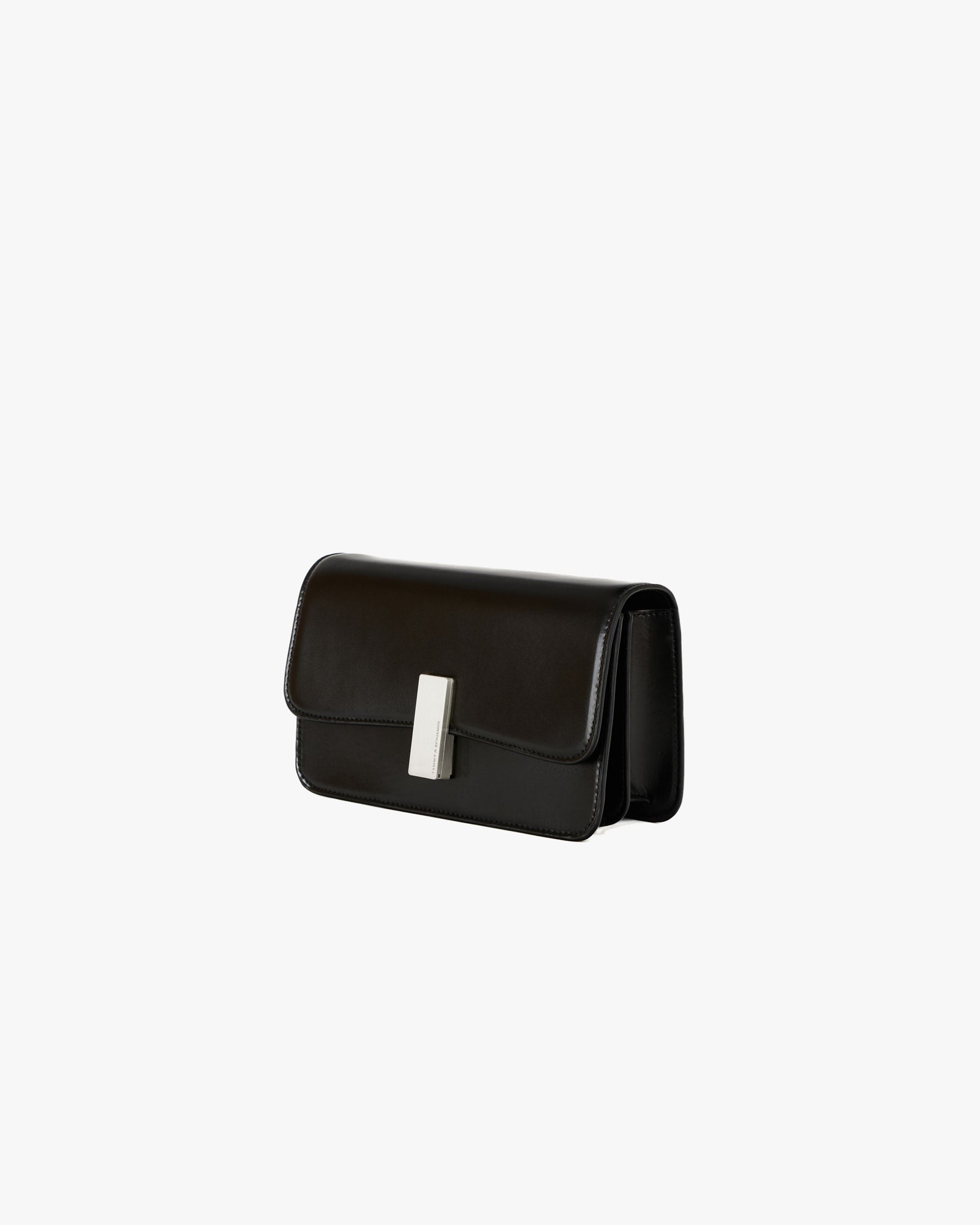 BLAKE bag in Black, three-quarter view, standing, closed flap with rectangular metal clasp visible