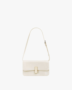 Sac BLAKE Ivoire de face, fermoir rectangulaire doré, bandoulière fine posée en arc