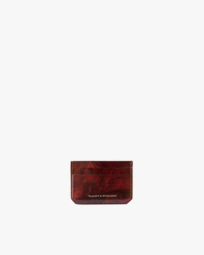 Porte-cartes CARDY en cuir marbre, vue de face, posé, logo doré visible