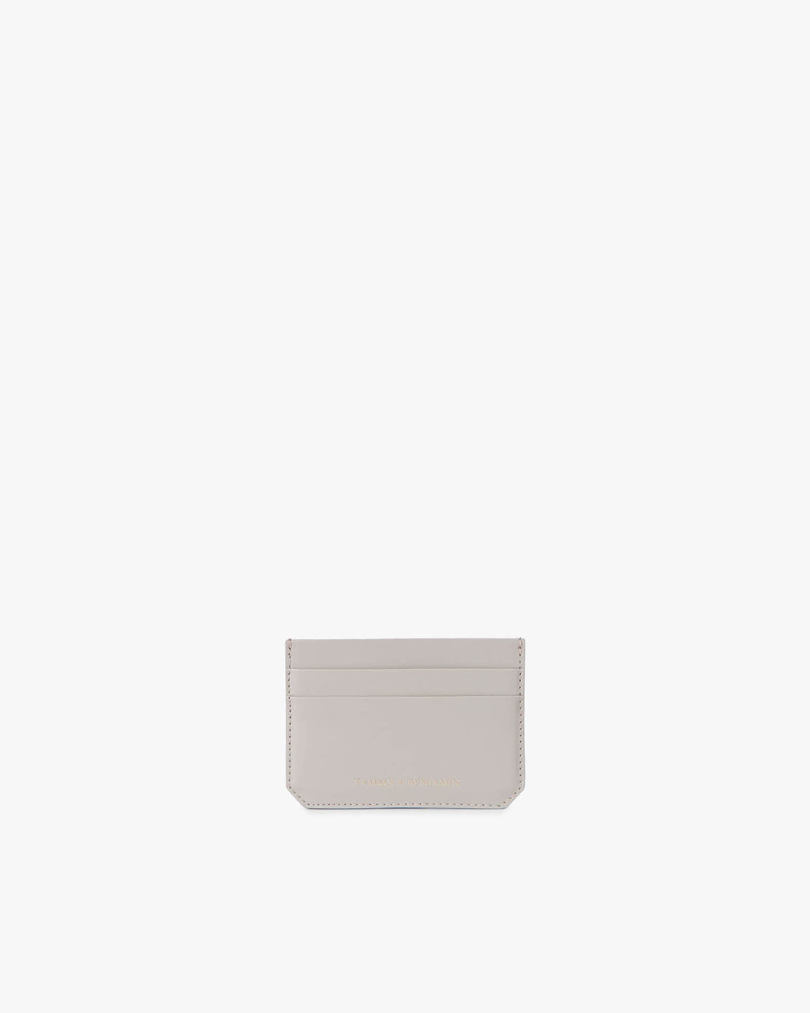Porte-cartes CARDY en cuir taupe, vue de face, compartiments à cartes visibles, logo doré