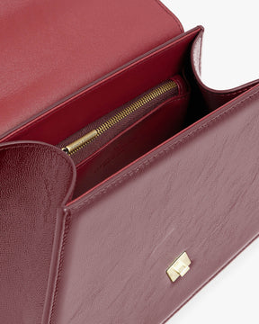 Sac CUBIST bordeaux naplak, vue intérieure ouverte montrant la poche zippée et le fermoir doré