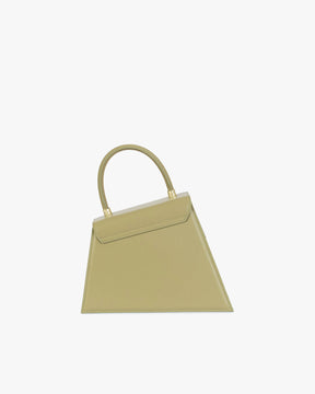 Sac CUBIST Limestone de profil, poignée ronde relevée, silhouette asymétrique trapézoïdale