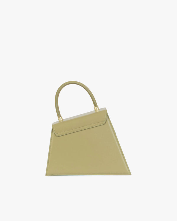 Sac CUBIST Limestone de profil, poignée ronde relevée, silhouette asymétrique trapézoïdale