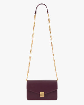 ELEANOR bag in Aubergine, laid flat with gold chain extended, Marble Arch clasp visible