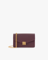 ELEANOR bag in Aubergine, front view, standing, with gold Marble Arch clasp and removable chain