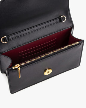 Sac ELEANOR Noir ouvert, vue intérieure sur le porte-cartes, la poche zippée et le fermoir doré