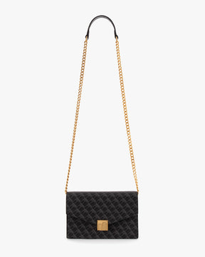 ELEANOR bag in black monogram coated canvas, worn crossbody with gold chain