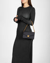 ELEANOR bag in black monogram coated canvas, worn on the shoulder with chain, gold Marble Arch clasp
