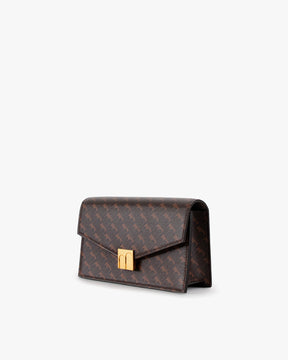 ELEANOR bag in Chocolate, side angle view, resting, gold Marble Arch clasp visible