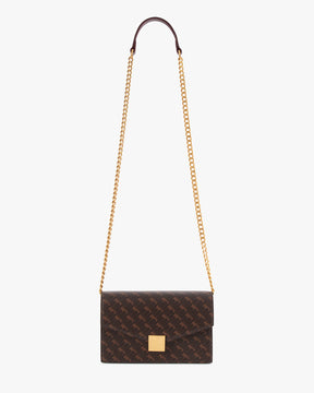 ELEANOR bag in Chocolate monogram, hanging by its gold chain and leather shoulder strap