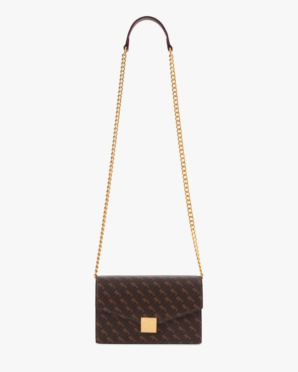 Sac ELEANOR Chocolat monogram suspendu par sa chaîne dorée et son repose-épaule en cuir