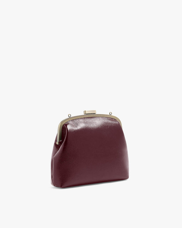 EMMA bag in Bordeaux naplak, three-quarter view, metal frame clasp, shown without strap