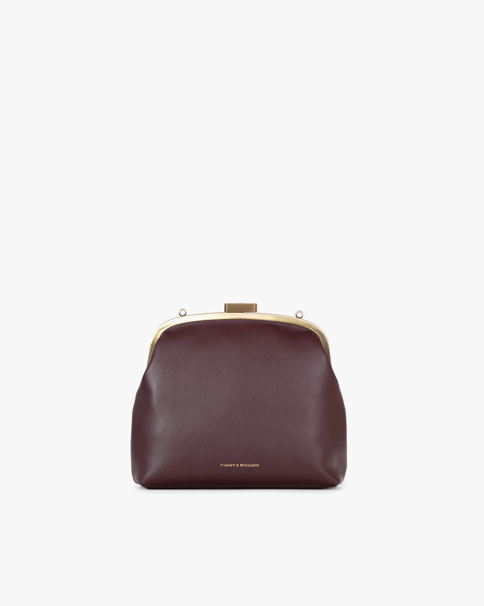 Sac EMMA en cuir aubergine, vue de face, posé, fermoir doré, sans bandoulière
