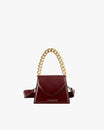 GABRIELLE bag in burgundy naplak, front view with gold chain handle and leather strap