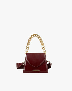 GABRIELLE bag in burgundy naplak, front view with gold chain handle and leather strap