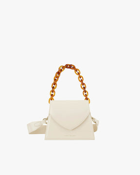 GABRIELLE bag in Ivory, front view, standing, with short amber chain handle and leather strap