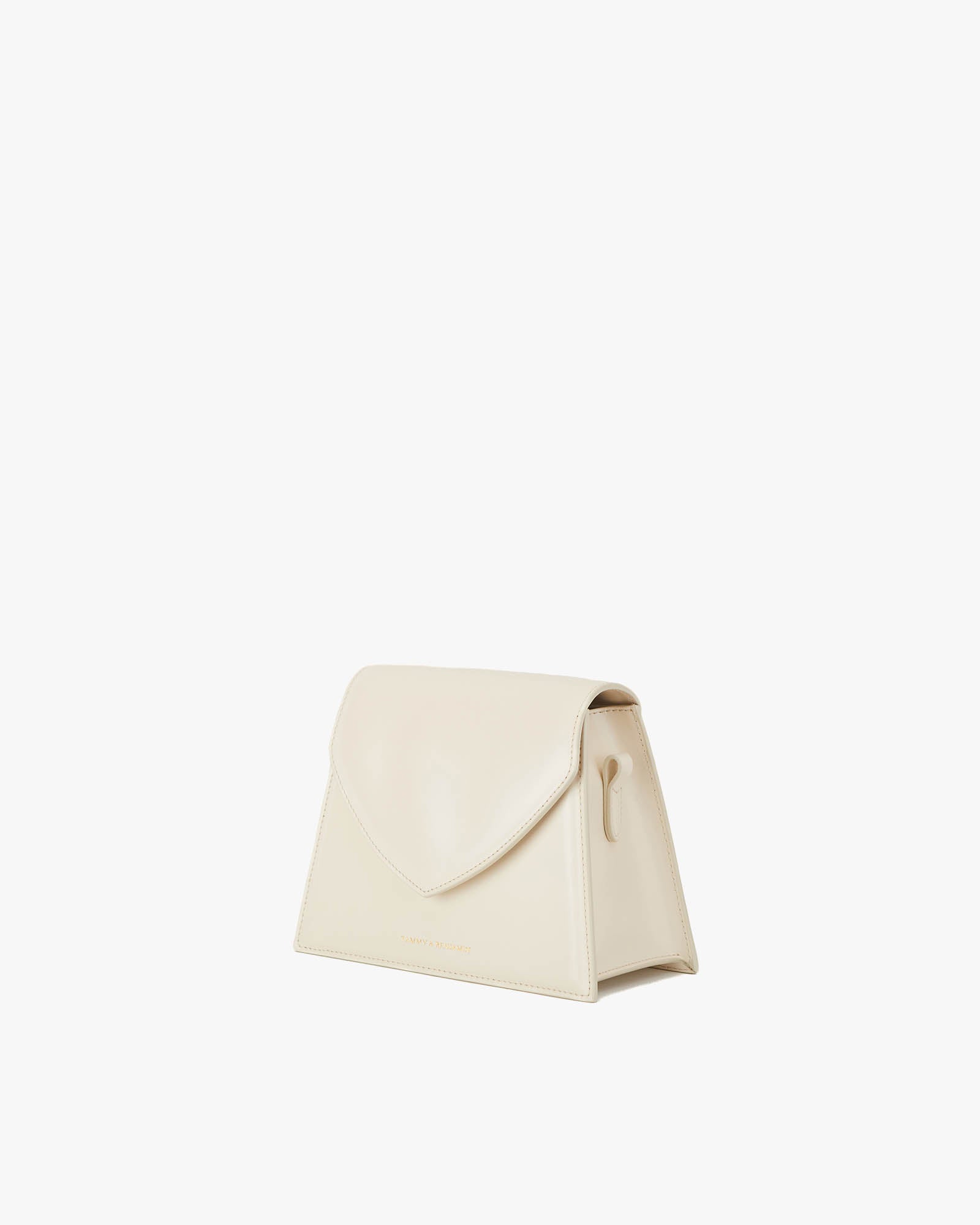 GABRIELLE bag in Ivory, three-quarter view, standing, pointed flap closed
