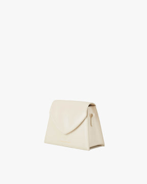 GABRIELLE bag in Ivory, three-quarter view, standing, pointed flap closed